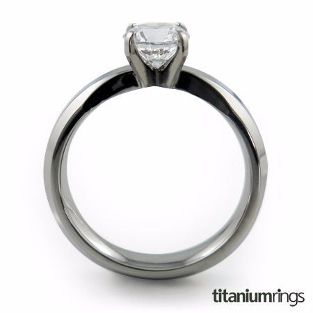 a titanium ring with a slender band and single prong setting that is extremely comfortable to wear. The model shown contains a 6mm round center stone.