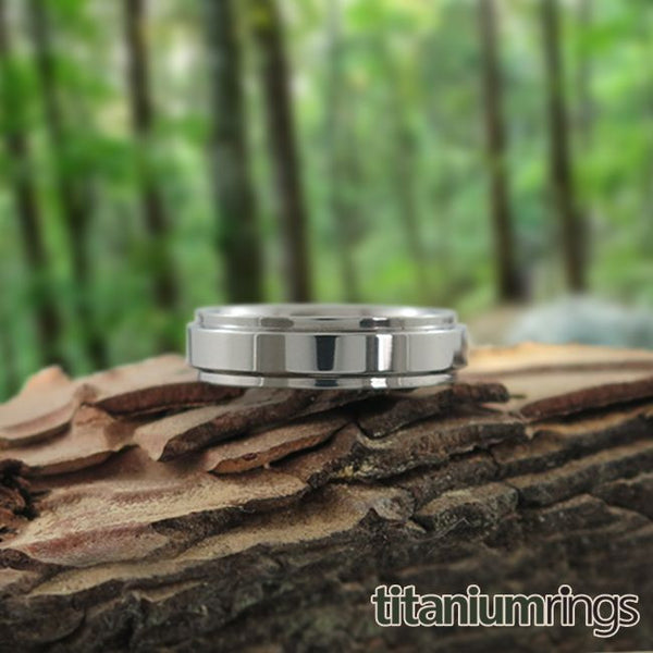 Ladies Aria titanium ring features squared edge cuts on each side to further accent its crisp, classic look.