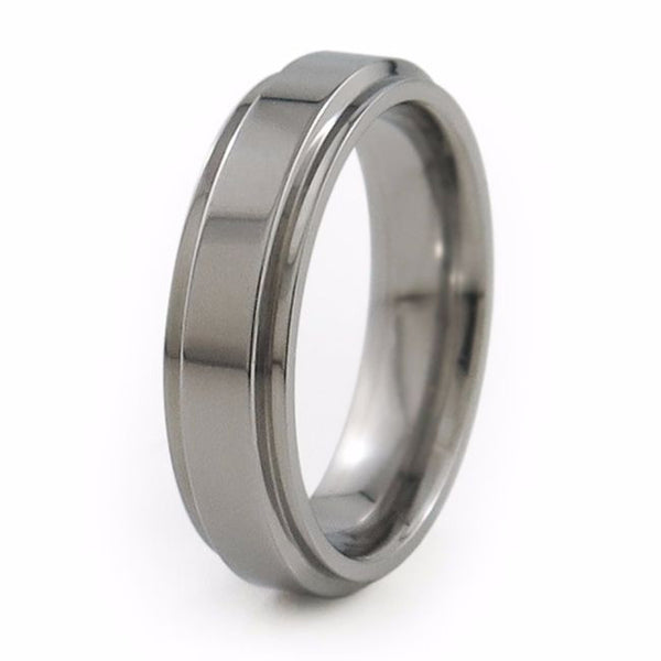 Ladies Aria titanium ring features squared edge cuts on each side to further accent its crisp, classic look.