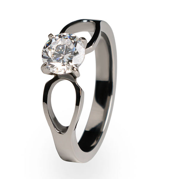 Slender and attractive, this solitaire engagement ring is made of pure, hypoallergenic Titanium. Choose from a wide selection of diamonds and gemstones and make this beautiful ring your own. 