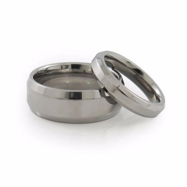Matching titanium wedding set with sculpted edges and comfort fit. 