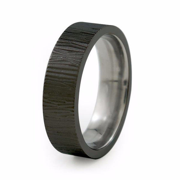 Contemporary black titanium ring with textured lines. Unisex titanium ring