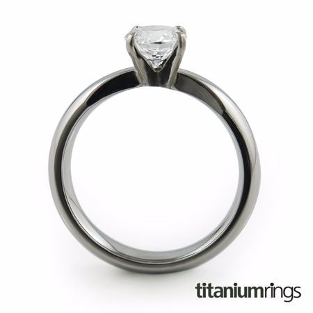 classic solitaire Titanium ring, featuring a dome profile band adorned with a beautiful gem.