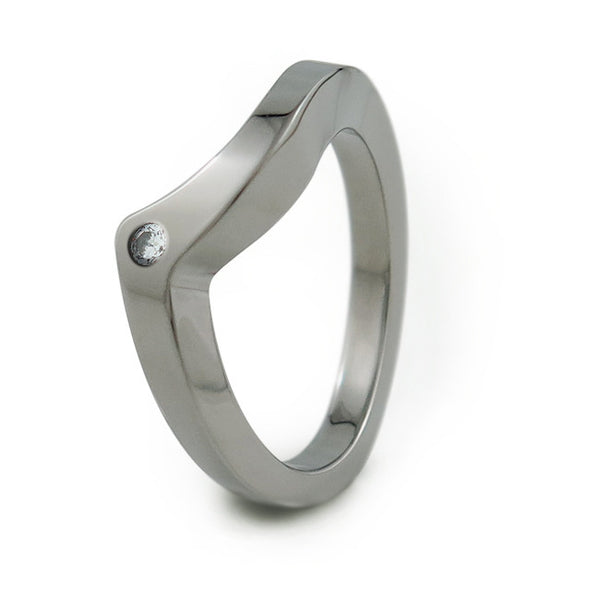 The Stella titanium companion band was created to complete the Stella wedding set.  We offer the option to have a small, 2mm round accent diamond, or colored gemstone in this ring design.