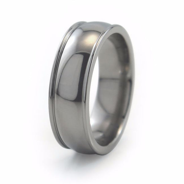 The Chrysalis titanium ring features a wider centre domed profile, accented by two narrow, raised edges on each side