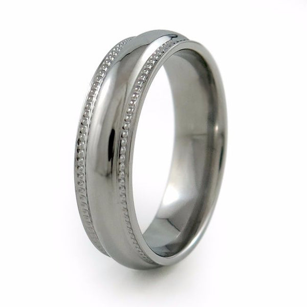 The Crescent Titanium wedding ring is a classic domed band that has received a beautiful double row of "milgrain" (tiny bead shapes). This milgraining brings a certain vintage jewelry transformation to this classically shaped band.