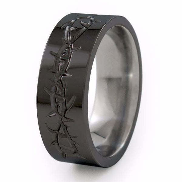 Titanium Ring with a barbed wire design neatly carved into the surface giving the Taboo Titanium ring a cool, rebel-like appeal.