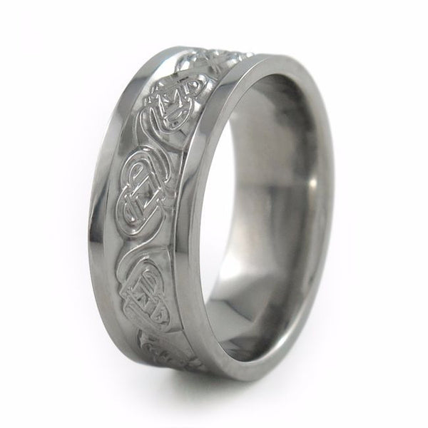 titanium ring etched with heart shaped symbols 