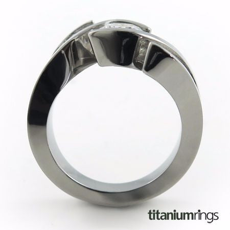 Ladies Titanium Ring with diamonds. This one-of-a-kind creation features a triple tension setting that makes your Diamonds or gemstones appear to float in a flowing wave. 