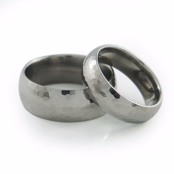 This gently domed Crater Titanium ring was further enhanced with an antiqued, hammered texture. The bumpy surface is rugged yet elegant and provides a smooth, comfortable feel.