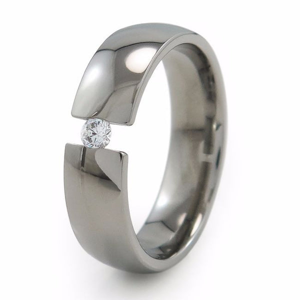 Classic simple elegant titanium ring or wedding band with a single inset gemstone  