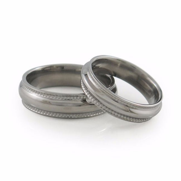 The Crescent Titanium wedding ring is a classic domed band that has received a beautiful double row of 
