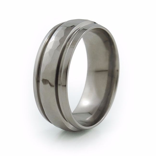 Titanium ring is a domed band and features deeply carved grooves with hammered finish around the center.