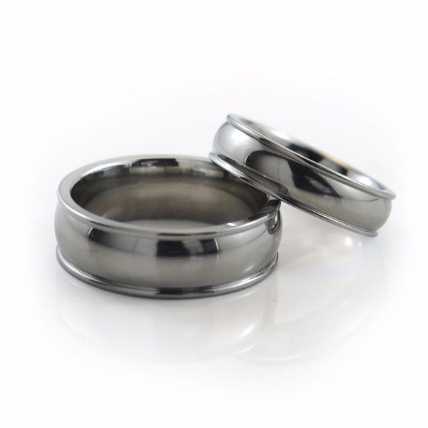The Chrysalis titanium ring features a wider centre domed profile, accented by two narrow, raised edges on each side