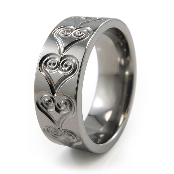 Titanium Ring adorned with heart etchings and engravings around the band. 