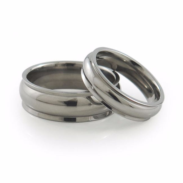 Ladies titanium ring urvy dome center is adorned by two wing-like, slanted edges and has an airy feel. I