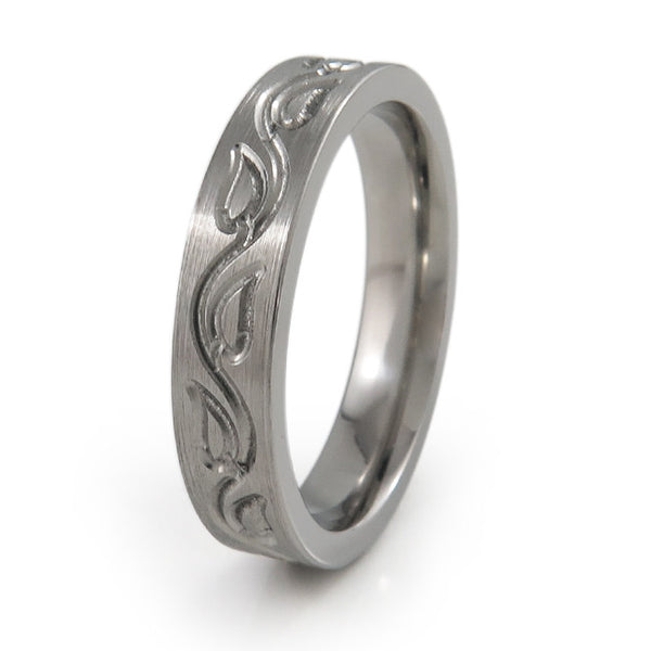 The Vineleaves titanium ring features a dainty and feminine vine leaf carving all around the ring. This titanium ring can be further personalized with your preferred color accent and finish